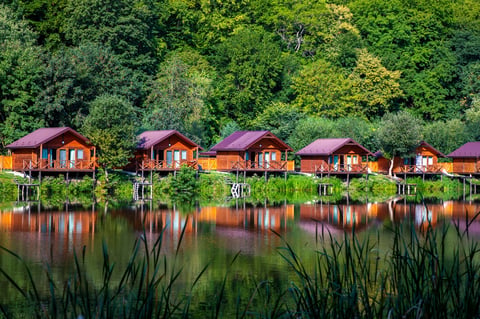 Wooden houses on the water near the forest for relaxation in nature