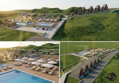 Aerial view of resort at sunset with pools and lodges